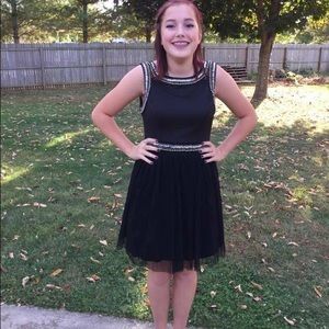 Black dress with sequin beading details.